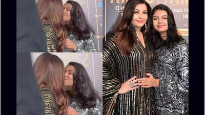 Aishwarya Rai kisses Aaradhya Bachchan at an award function; Abhishek Bachchan gives the event a miss Aishwarya Rai kisses Aaradhya Bachchan at an award function; Abhishek Bachchan gives the event a miss